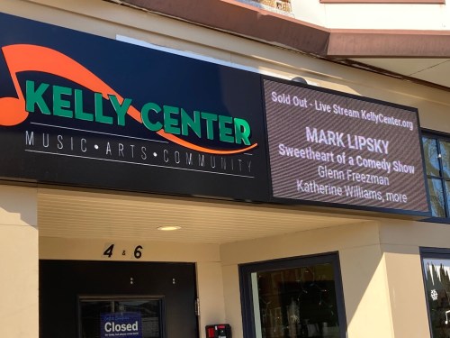 Sign outside the Kelly Center announcing a sold-out live stream comedy show featuring Mark Lipsky and others.
