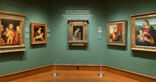 Art gallery featuring Renaissance paintings, with framed artworks displayed on green walls and a central title sign.