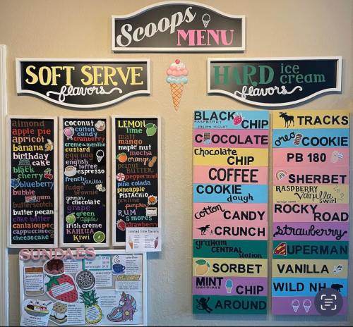 A colorful ice cream menu displaying soft serve and hard ice cream flavors, along with sundae options.