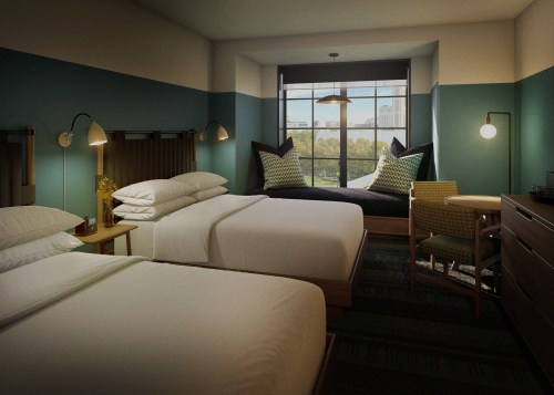 A modern hotel room with two beds, a cozy window seat, and stylish decor in teal and neutral tones.