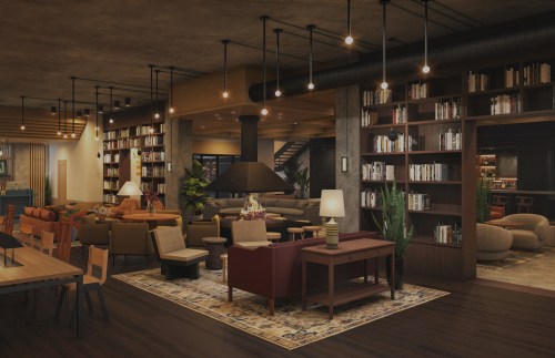 Cozy modern lounge with bookshelves, comfortable seating, and warm lighting, creating an inviting atmosphere.