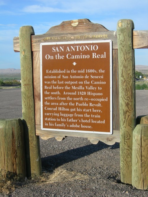 Sign marking San Antonio on the Camino Real, detailing its history and significance as a mission and outpost.