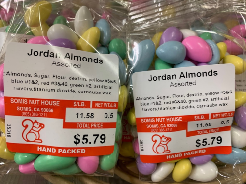 Two bags of Jordan Almonds with colorful candy-coated almonds and price tags showing $5.79 each.