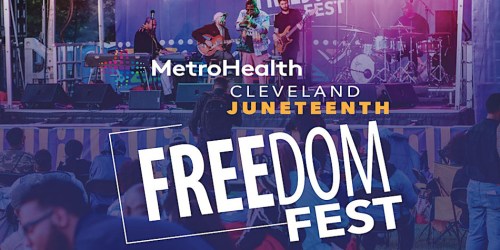 A lively outdoor music festival scene with performers on stage and an audience enjoying the event.
