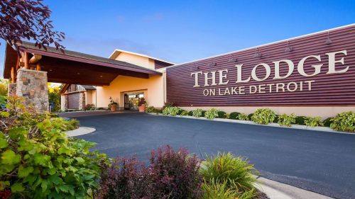 Exterior view of The Lodge on Lake Detroit, featuring a welcoming entrance and landscaped surroundings.