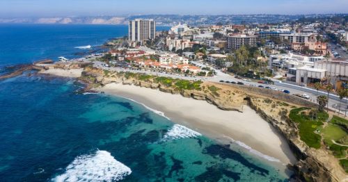 Aerial view of La Jolla, California, including the ocean and tall buildings and hotels