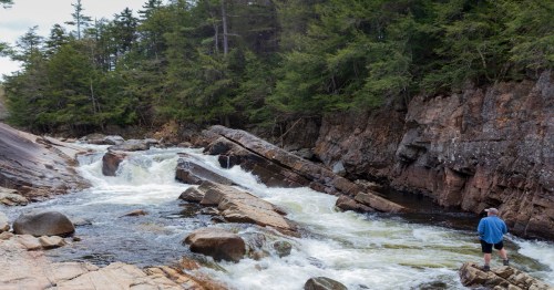Hiker impressed by the awesome Sacandaga River and Griffin Falls in Upstate New York.