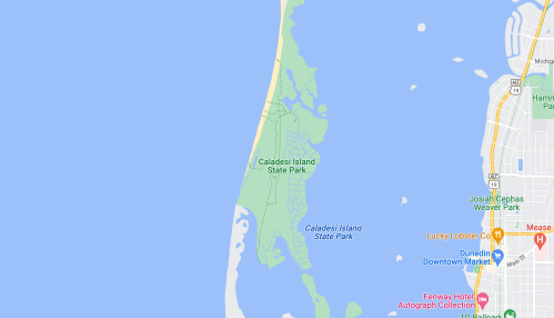 Map showing Caladesi Island State Park, surrounded by water, with nearby areas labeled.
