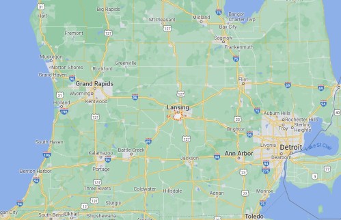 Map of Michigan highlighting major cities like Lansing, Detroit, and Grand Rapids, with highways and surrounding areas.