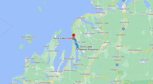 Map showing Torch Lake Cafe and Torch Lake Nature Preserve in Michigan, with nearby towns and roads marked.
