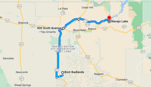 Map showing a route from Ojo Amarillo to Navajo Lake, passing through Bisti Badlands and nearby landmarks.