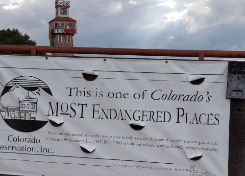 A banner reading "This is one of Colorado's MOST Endangered Places" with a historic building in the background.