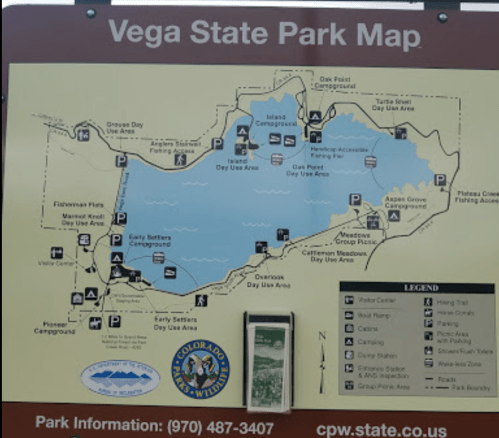 Map of Vega State Park showing campgrounds, day use areas, and facilities around a lake. Contact info included.