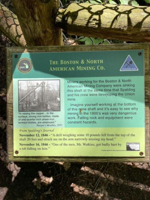 Sign about the Boston & North American Mining Co., detailing mining dangers and historical context from 1846.