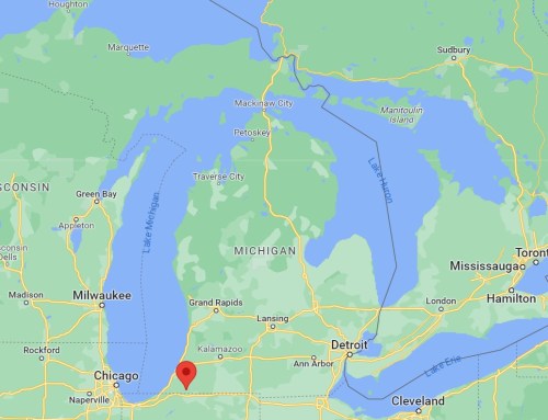 Map showing parts of the Great Lakes region, including Michigan, Illinois, and surrounding areas. Red marker near Chicago.