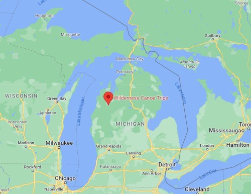 Map showing Michigan with a marker for "Wilderness Canoe Trips" in the northern part of the state.