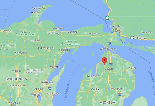 Map showing northern Michigan with a red marker indicating a location near Gaylord, surrounded by lakes and forests.