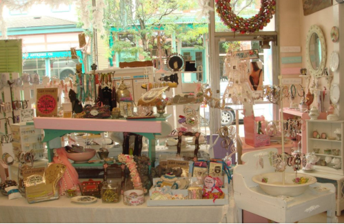 A colorful display of various jewelry and decorative items in a charming boutique setting.
