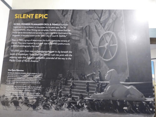 A wall display about Cecil B. DeMille's film "Silent Epic," featuring historical context and images related to the film.