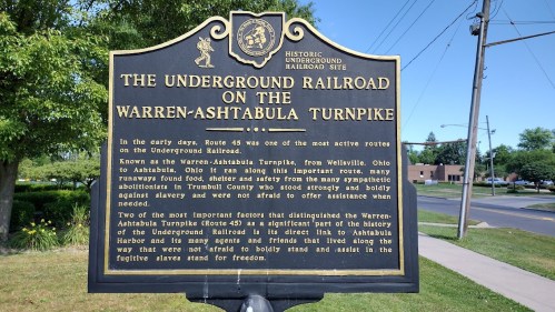 Historic marker detailing the Underground Railroad on the Warren-Ashtabula Turnpike, highlighting its significance and history.