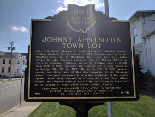 Historical marker for Johnny Appleseed's Town Lot in Ohio, detailing its significance and history.