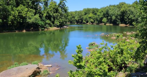 Views of a scenic lazy river in Maryland, surrounded by lush greenery.