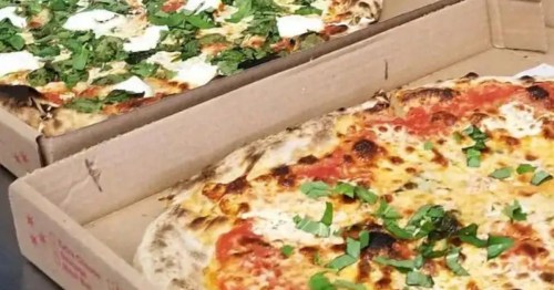 Two open boxes featuring a fresh margherita pie, representing authentic Pizza New Jersey.