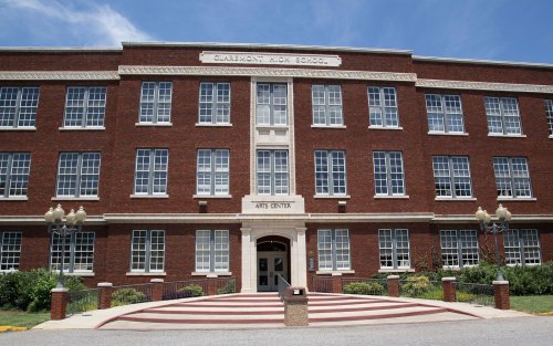 Exterior view of Claremont High School, featuring a brick facade and an entrance labeled "Art Center."