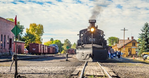 a train with Cumbres & Toltec Scenic Railroad leaves the chama depot in chama new mexico