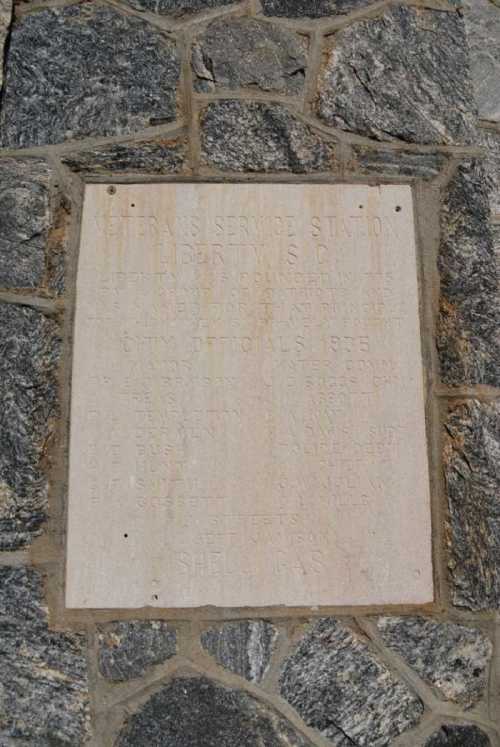 Plaque on a stone wall commemorating the Veterans Service Station in Liberty, Virginia, with names of city officials from 1975.