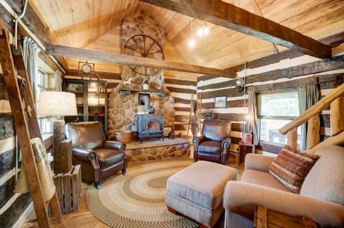 Cozy cabin interior with wooden beams, stone fireplace, and comfortable seating, creating a warm, rustic atmosphere.