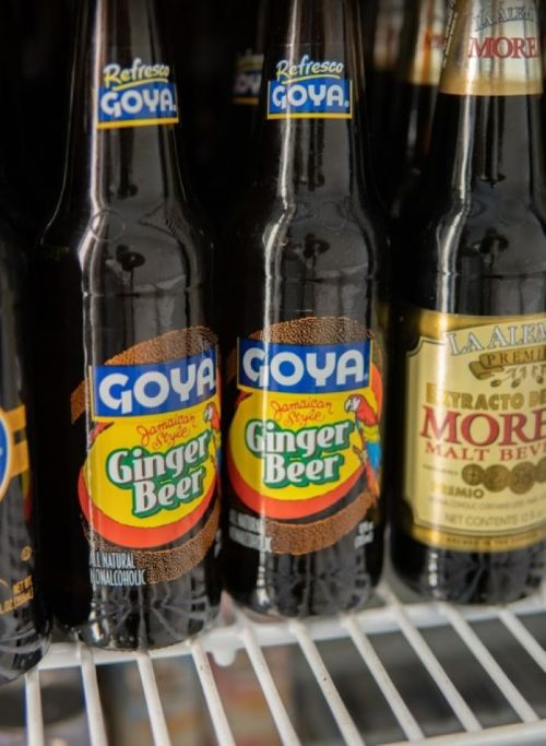 Two bottles of Goya Ginger Beer on a shelf, featuring colorful labels and a non-alcoholic designation.