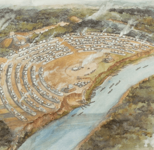 Aerial view of a historical settlement by a river, featuring circular housing arrangements and smoke rising from structures.