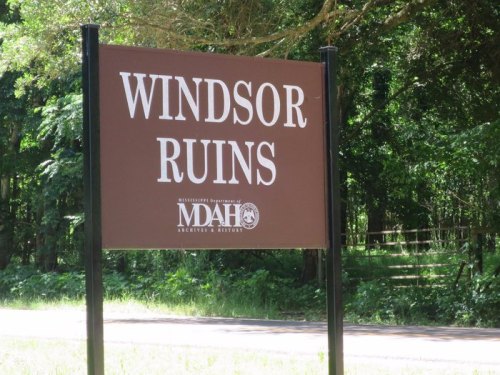 Sign for Windsor Ruins, a historic site in Mississippi, surrounded by lush greenery.