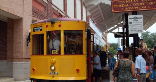 passengers board a train at Tampa bay train station.