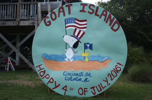 A colorful sign for Goat Island featuring Snoopy and Woodstock, celebrating the 4th of July, 2016.