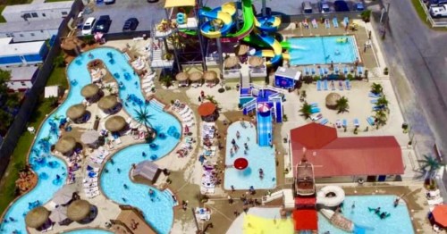 Aerial view of colorful slides and pools at this vibrant Waterpark in Delaware. An epic summer splash destination.
