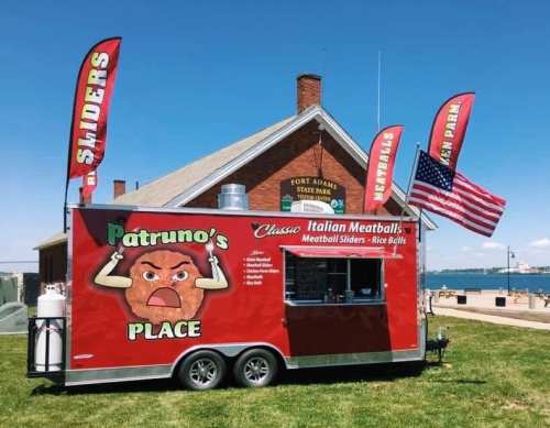 A food truck named "Patruno's Place" offers Italian meatballs and sliders, set against a park backdrop with flags.