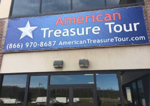 Sign for American Treasure Tour featuring a star and contact information.