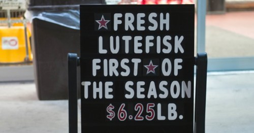 Sign advertising fresh lutefisk for $6.25 per pound, labeled as the first of the season.