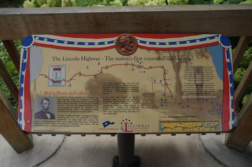 Sign detailing the Lincoln Highway, America's first coast-to-coast highway, highlighting its history and cultural significance.