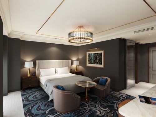 A stylish hotel room featuring a king bed, elegant decor, a chandelier, and a cozy seating area.