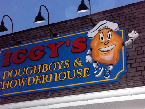 Colorful sign for Iggy's Doughboys & Chowderhouse featuring a cartoonish character waving.