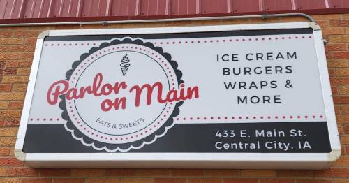 Sign for "Parlor on Main" featuring ice cream, burgers, wraps, and more. Located at 433 E. Main St., Central City, IA.