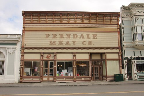 Historic building of Ferndale Meat Co. with ornate architecture and large windows, located in a charming town.