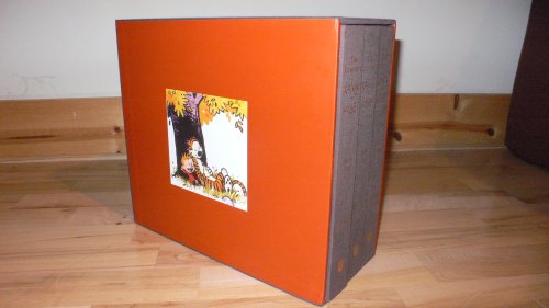 A colorful box set featuring a cartoon illustration, resting on a wooden floor.