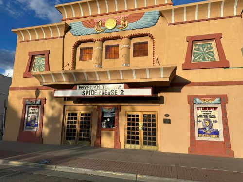 Exterior of the Egyptian Theatre featuring a marquee for "Spider-Verse 2" and colorful, decorative architecture.