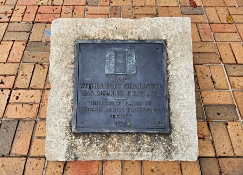 Plaque commemorating Mobile's first jail, located at Fort Charlotte, placed by the Historic Mobile Preservation Society, 1954.