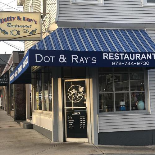 Exterior view of Dot & Ray's Restaurant, featuring a sign and storefront with large windows.