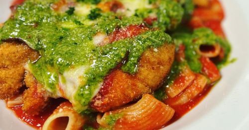 Close-up of chicken pesto pasta in a white bowl from Warwick, Rhode Island